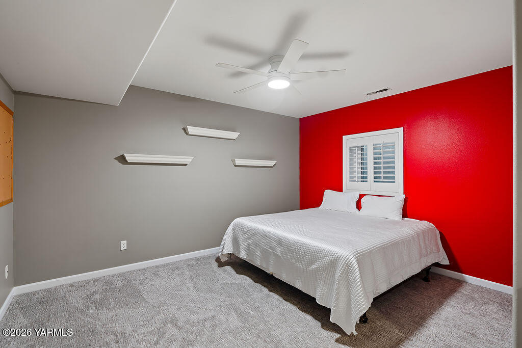 6810 Ravens Gate Way Yakima, WA 98908 - Photo 37 of 49 a bedroom with a bed and a ceiling fan