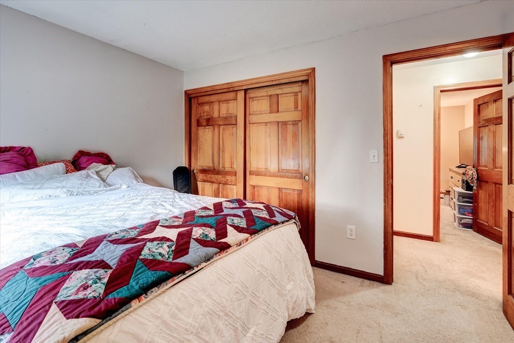 6 Litchfield Road, Unit A Londonderry, NH 03053 - Photo 14 of 28 a bedroom with a bed and a window