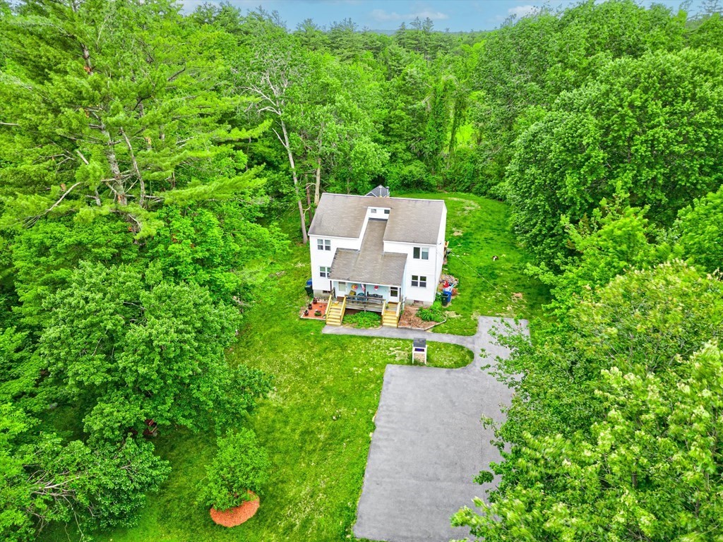 6 Litchfield Road, Unit A Londonderry, NH 03053 - Photo 23 of 28 a view of a garden with lawn chairs