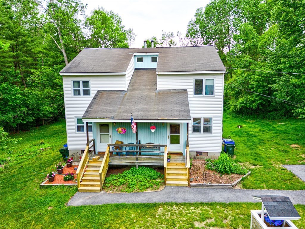 6 Litchfield Road, Unit A Londonderry, NH 03053 - Photo 24 of 28 a aerial view of a house with table and chairs