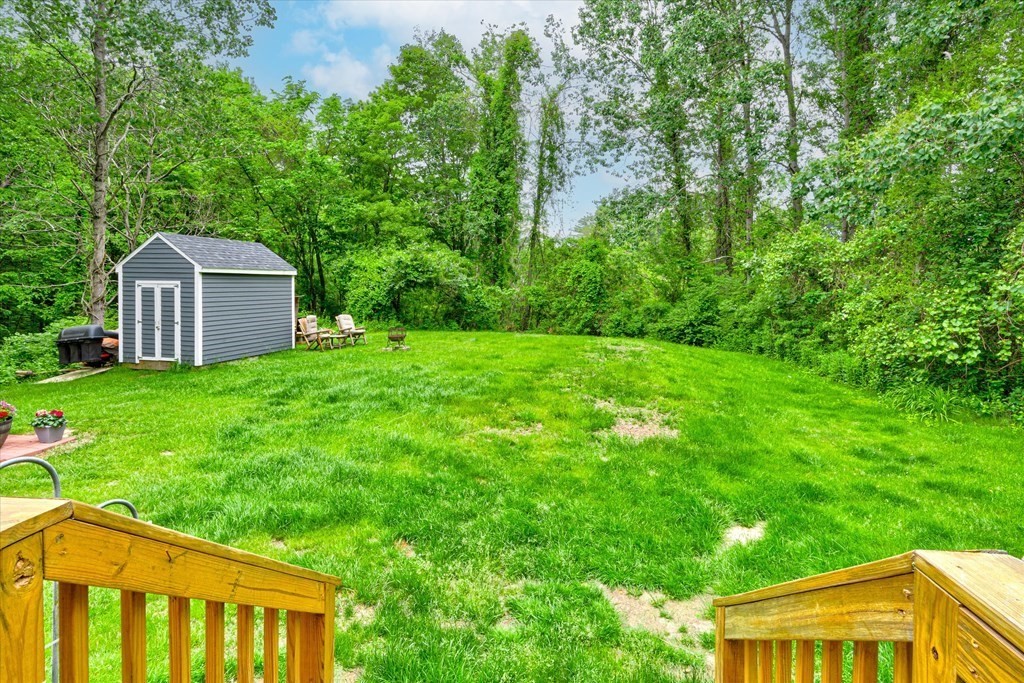 6 Litchfield Road, Unit A Londonderry, NH 03053 - Photo 28 of 28 a view of a house with a backyard