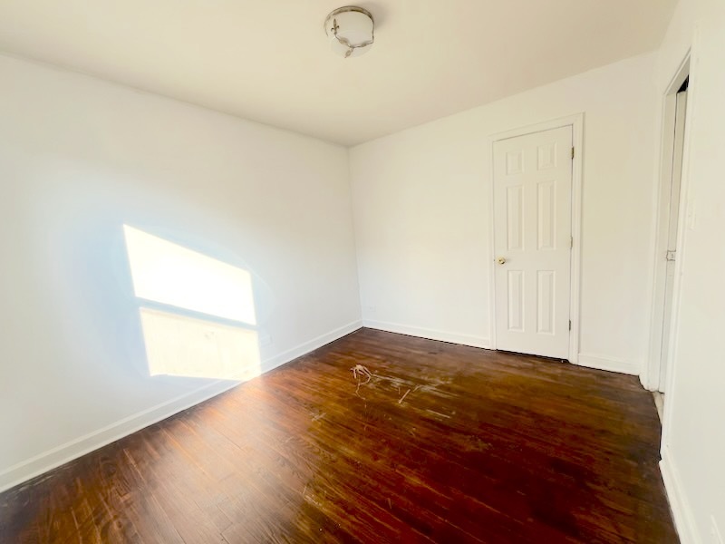 6557 North California Avenue, Unit 2S Chicago, IL 60645 - Photo 7 of 7 a view of empty room with wooden floor