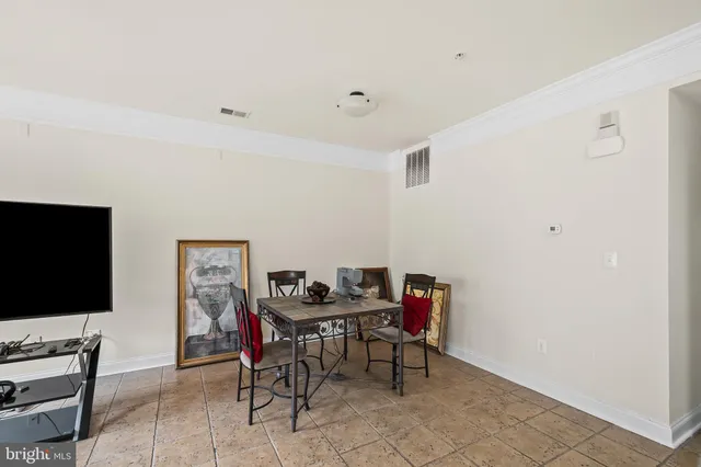 a view of a livingroom with furniture and a flat screen tv