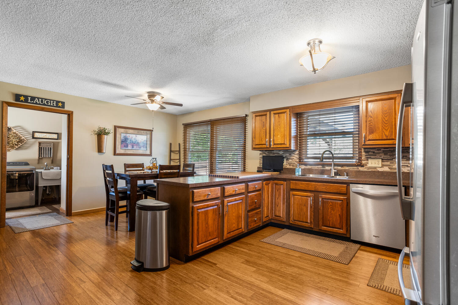1437 Golf Terrace Danville, IL 61832 - Photo 13 of 40 a kitchen with stainless steel appliances granite countertop sink stove and wooden cabinets