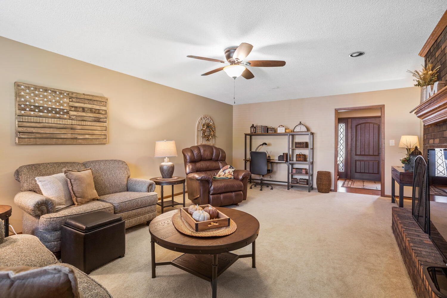 1437 Golf Terrace Danville, IL 61832 - Photo 20 of 40 a living room with furniture a clock and a window