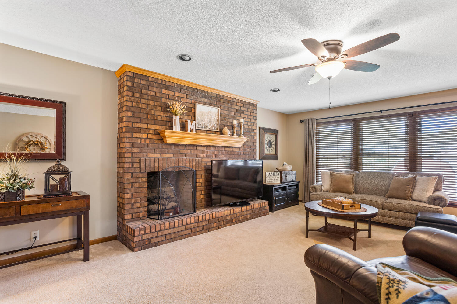 1437 Golf Terrace Danville, IL 61832 - Photo 21 of 40 a living room with furniture and a fireplace