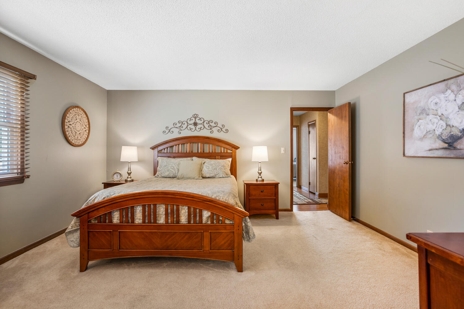1437 Golf Terrace Danville, IL 61832 - Photo 24 of 40 a bedroom with a bed a mirror and paintings on the wall