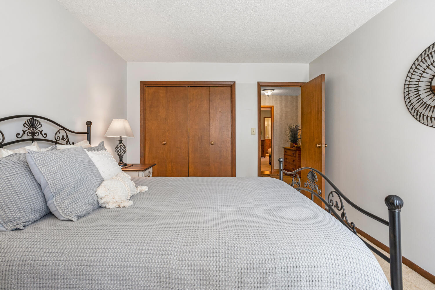 1437 Golf Terrace Danville, IL 61832 - Photo 28 of 40 a bedroom with a large bed and a chandelier