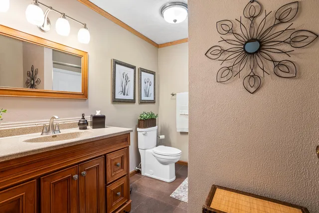 a bathroom with a shower a toilet and sink