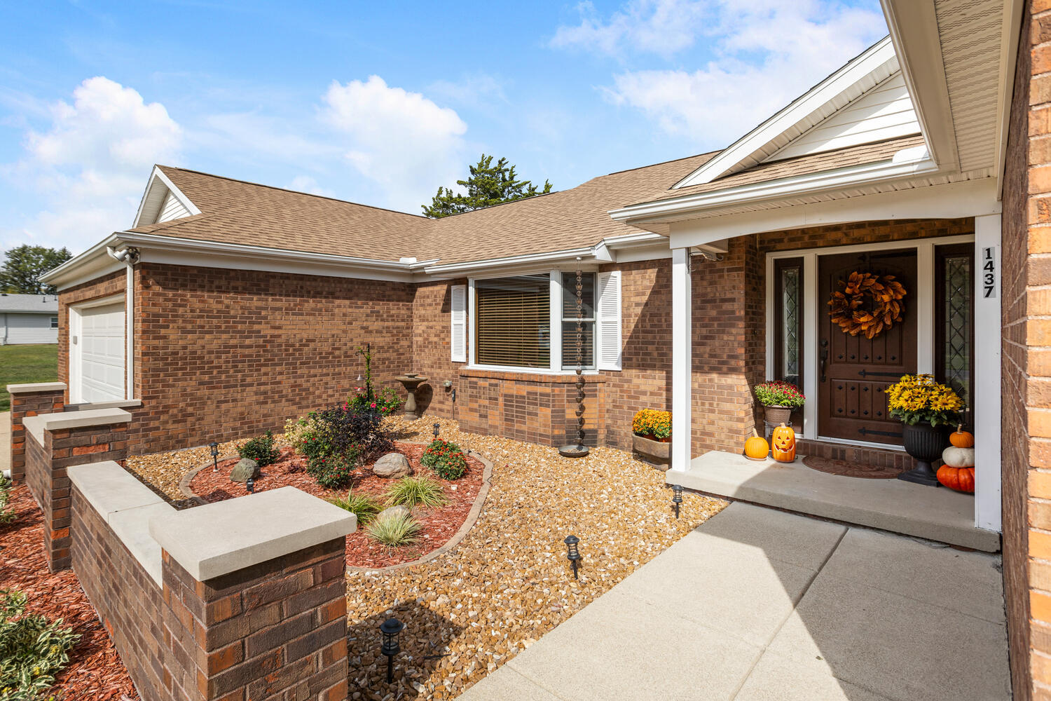 1437 Golf Terrace Danville, IL 61832 - Photo 3 of 40 a view of a patio with couches table and chairs and potted plants