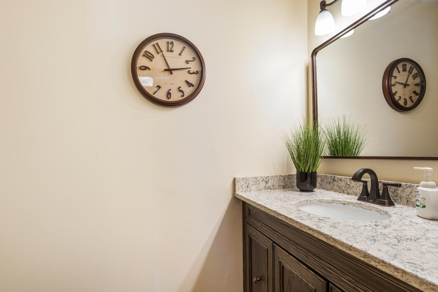 1437 Golf Terrace Danville, IL 61832 - Photo 34 of 40 a view of a hallway with a wall clock and a wall painting