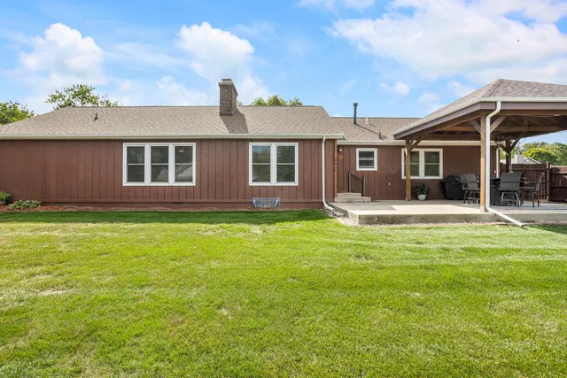 a view of a house with a yard patio and a patio
