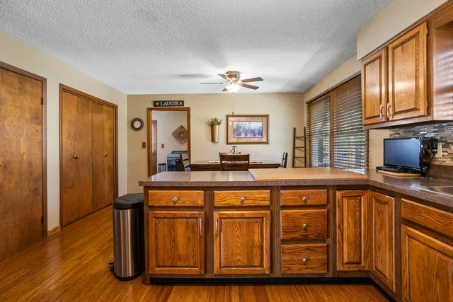 a kitchen with stainless steel appliances granite countertop a refrigerator stove and sink