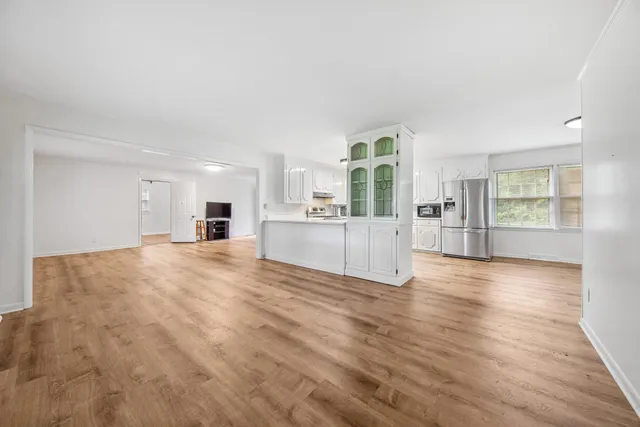 a view of a kitchen with a sink and a stove top oven