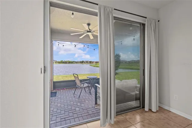 wooden floor view with a swimming pool and outdoor seating