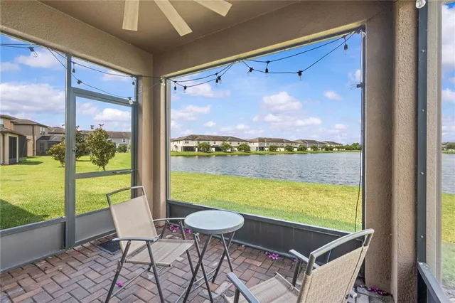 a room with furniture and large window