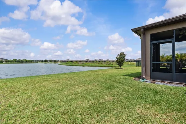 a view of a lake with a big yard