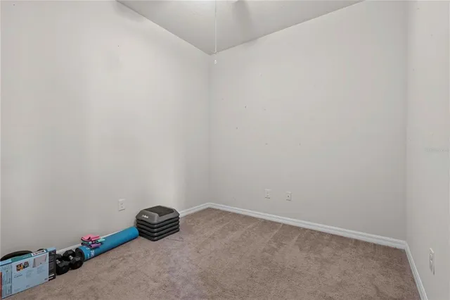 a view of a livingroom with furniture and a ceiling fan