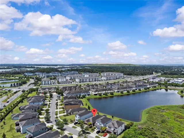 an aerial view of city and lake