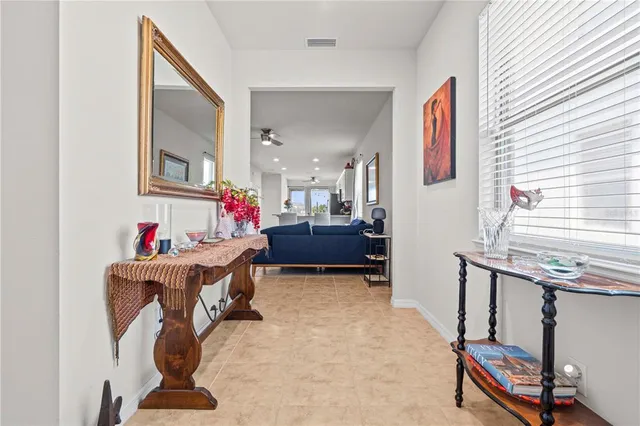 a bedroom with furniture and a mirror
