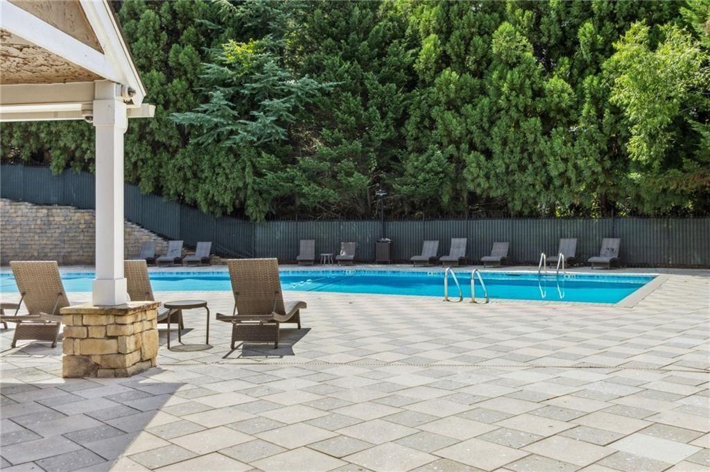 3155 Seven Pines, Unit 303 Atlanta, GA 30339 - Photo 23 of 25 a view of a chairs and table in the patio