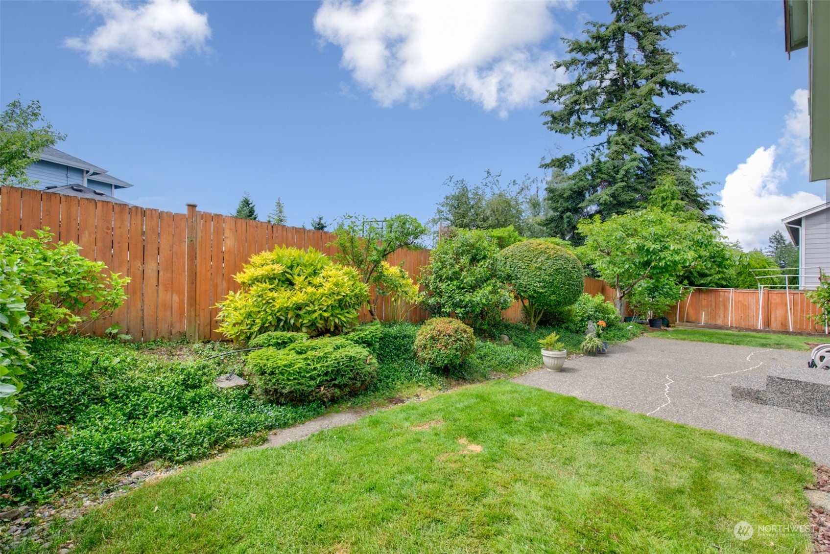 4022 220th Street Southeast Bothell, WA 98021 - Photo 23 of 24 a view of a backyard with plants