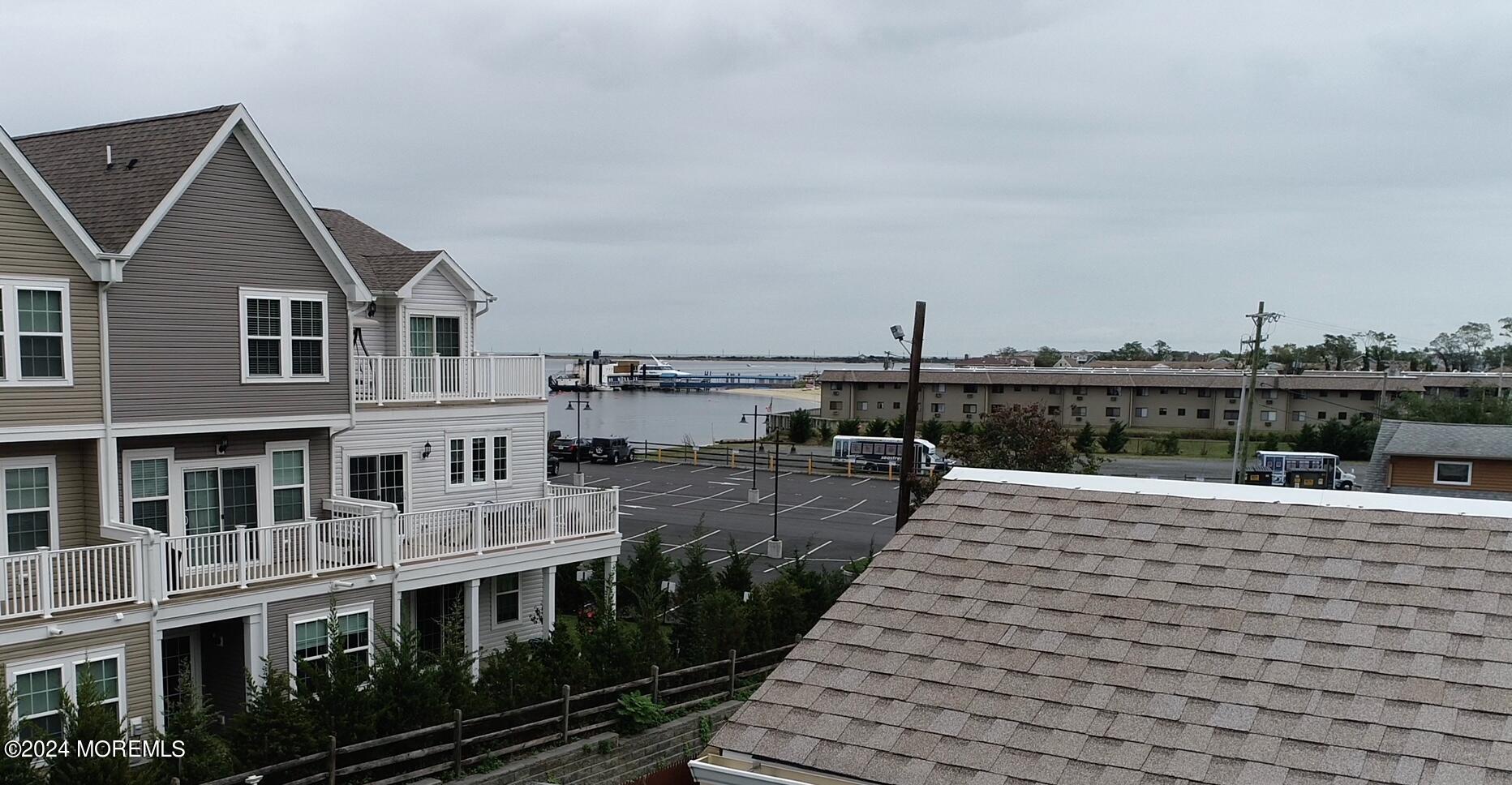 17 Locust Street Highlands, NJ 07732 - Photo 11 of 31 a view of a roof deck with couches and wooden floor
