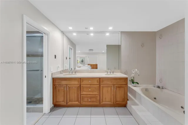a bathroom with a shower sink and mirror