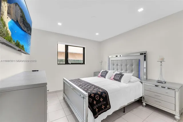 a bedroom with a bed and a mirror