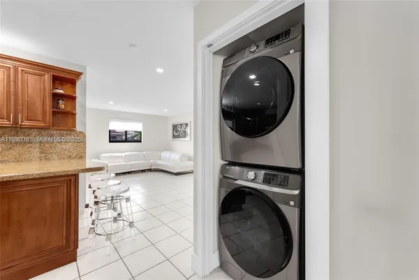 a spacious bedroom with a bed and a couch