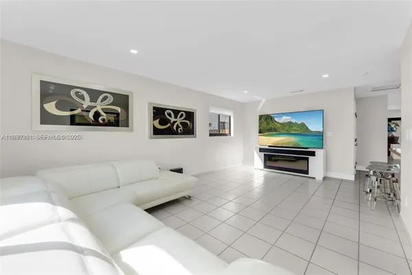 a balcony with chairs and a patio