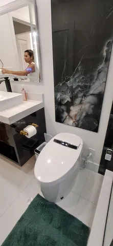 a spacious bedroom with a bed and a table