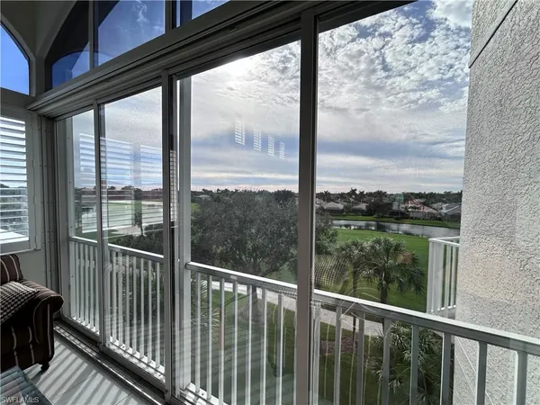 a view of a balcony with chairs