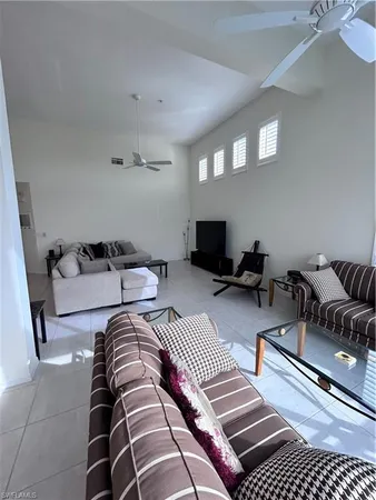 a bedroom with two beds and a couch