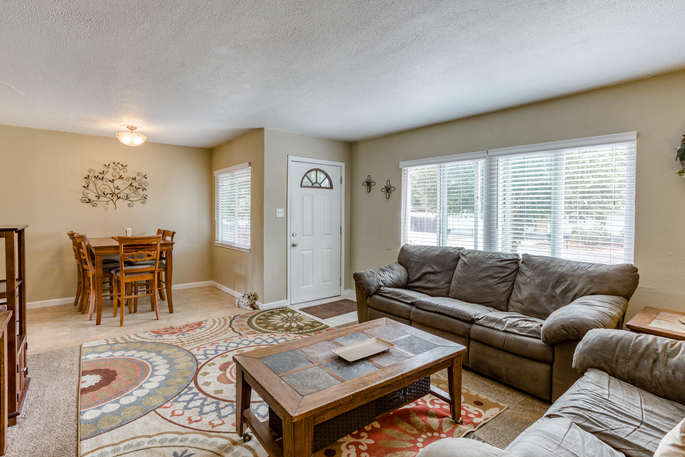 1111 Layton Road Redding, CA 96002 - Photo 4 of 19 a living room with furniture and a large window