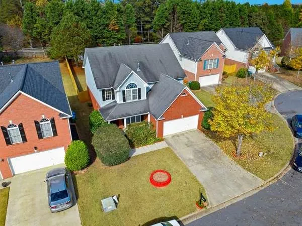 an aerial view of residential house with outdoor space