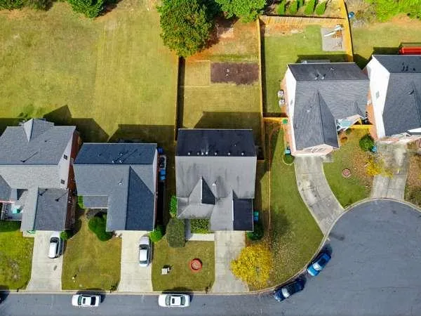 an aerial view of a house with a swimming pool