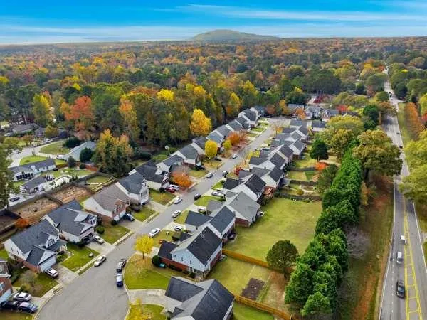 an aerial view of residential houses with outdoor space