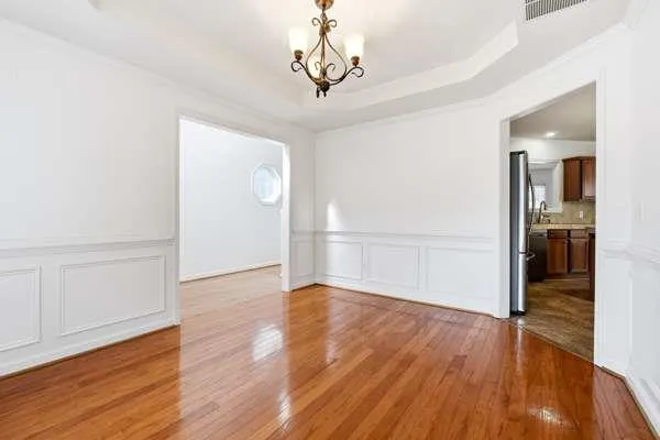 a view of a livingroom with wooden floor