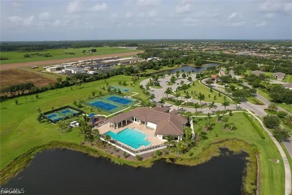 an aerial view of a house with a yard