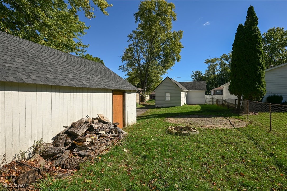 364 Stanley Road Akron, OH 44312 - Photo 5 of 29 View of yard featuring an outdoor fire pit and an outdoor structure