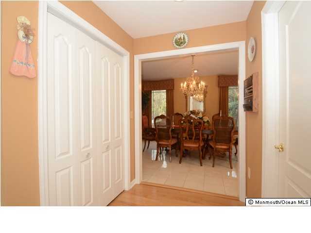 14 Highpoint Road Holmdel, NJ 07733 - Photo 12 of 17 a view of a dining room with furniture and a chandelier