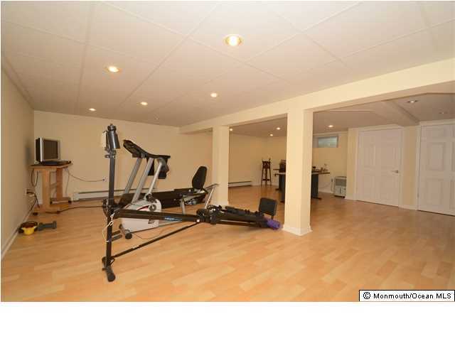 14 Highpoint Road Holmdel, NJ 07733 - Photo 16 of 17 a view of a room with gym equipment