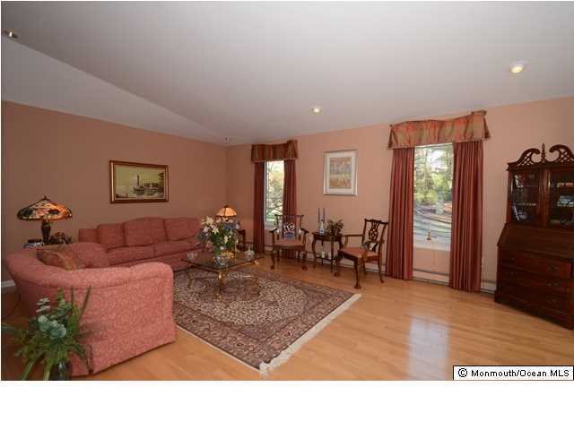 14 Highpoint Road Holmdel, NJ 07733 - Photo 7 of 17 a living room with furniture and wooden floor