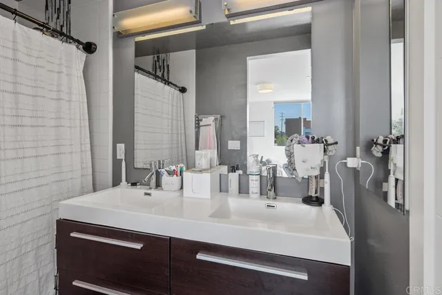a bathroom with a sink and a mirror