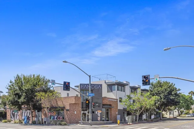 a view of a city with lots of palm trees