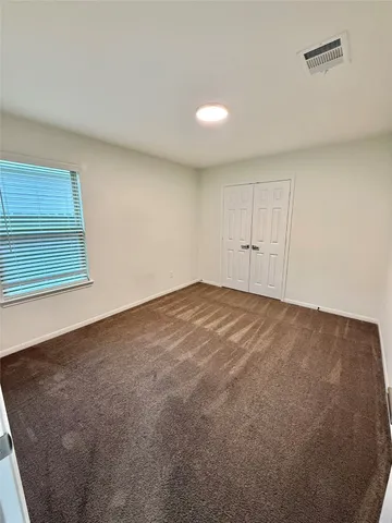 a view of a room with a sink and a mirror