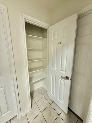 a bathroom with a granite countertop shower and a mirror