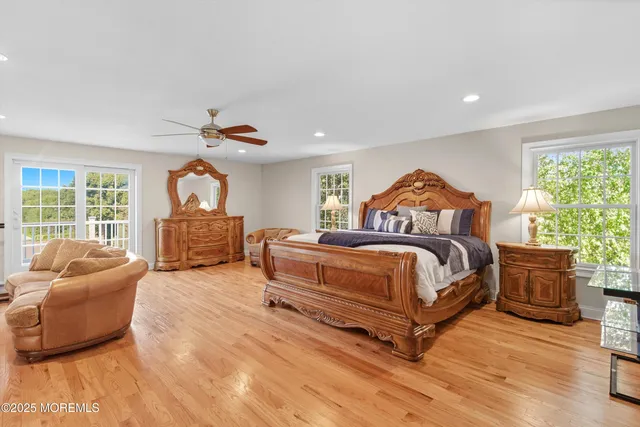 a bedroom with a bed couch and window