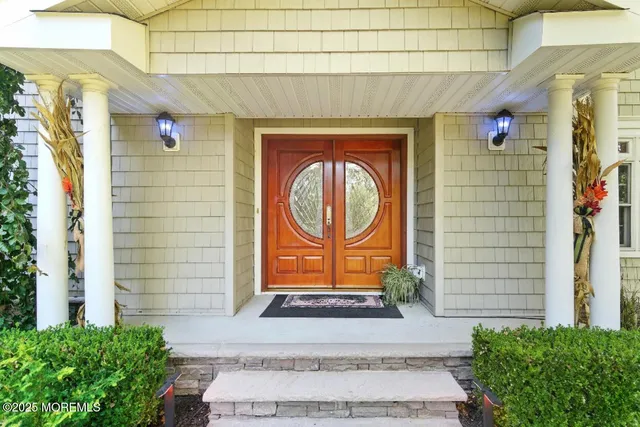 a front view of a house with large windows